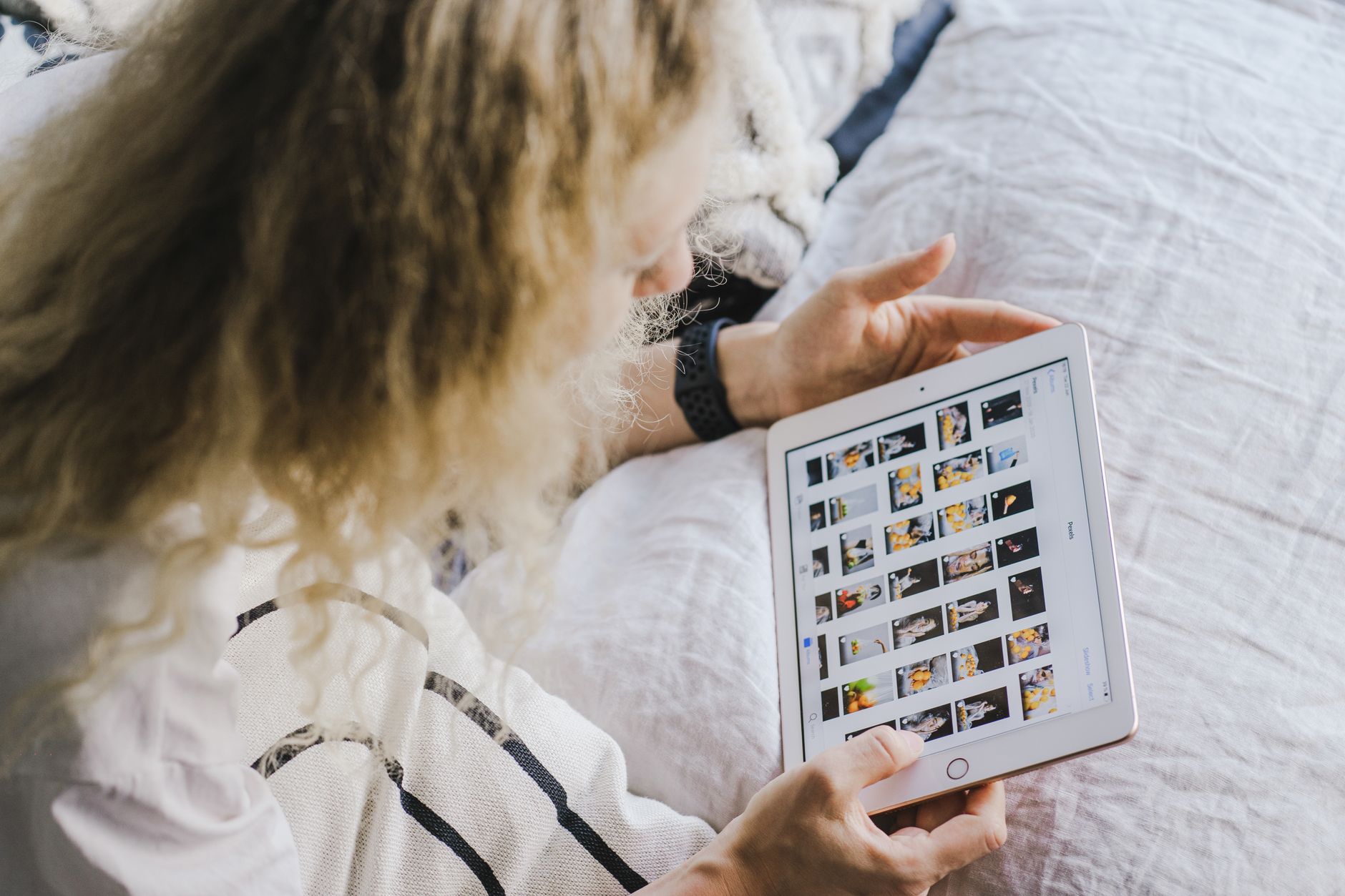 Hero image of Clean press or review photo of the Amazon Fire HD 10 held or propped up, showing the screen and bezels clearly — ideal as the lead representative tablet in the lineup