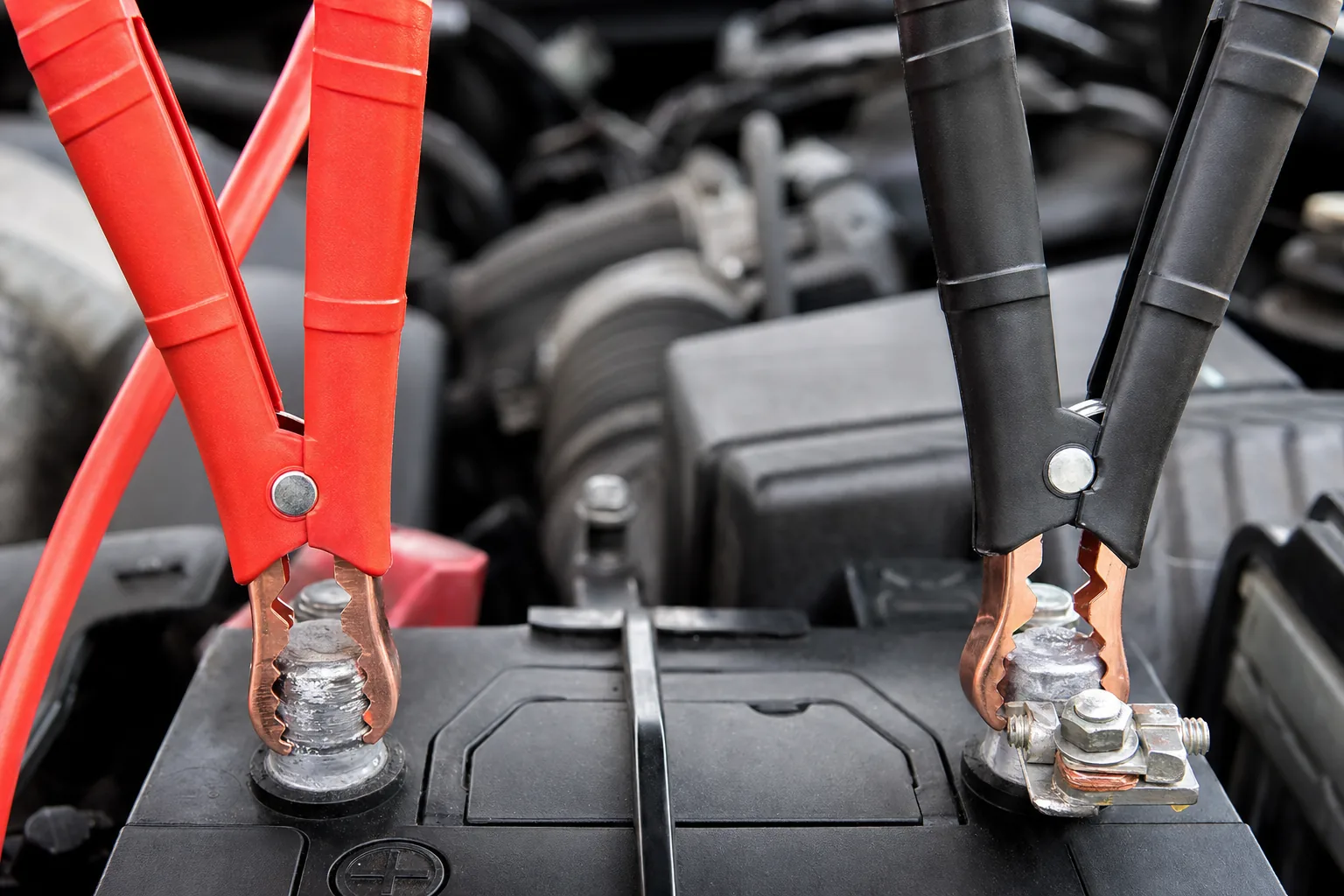 Clip red to positive, black to negative - smart clamps won't power up until the connection is right.