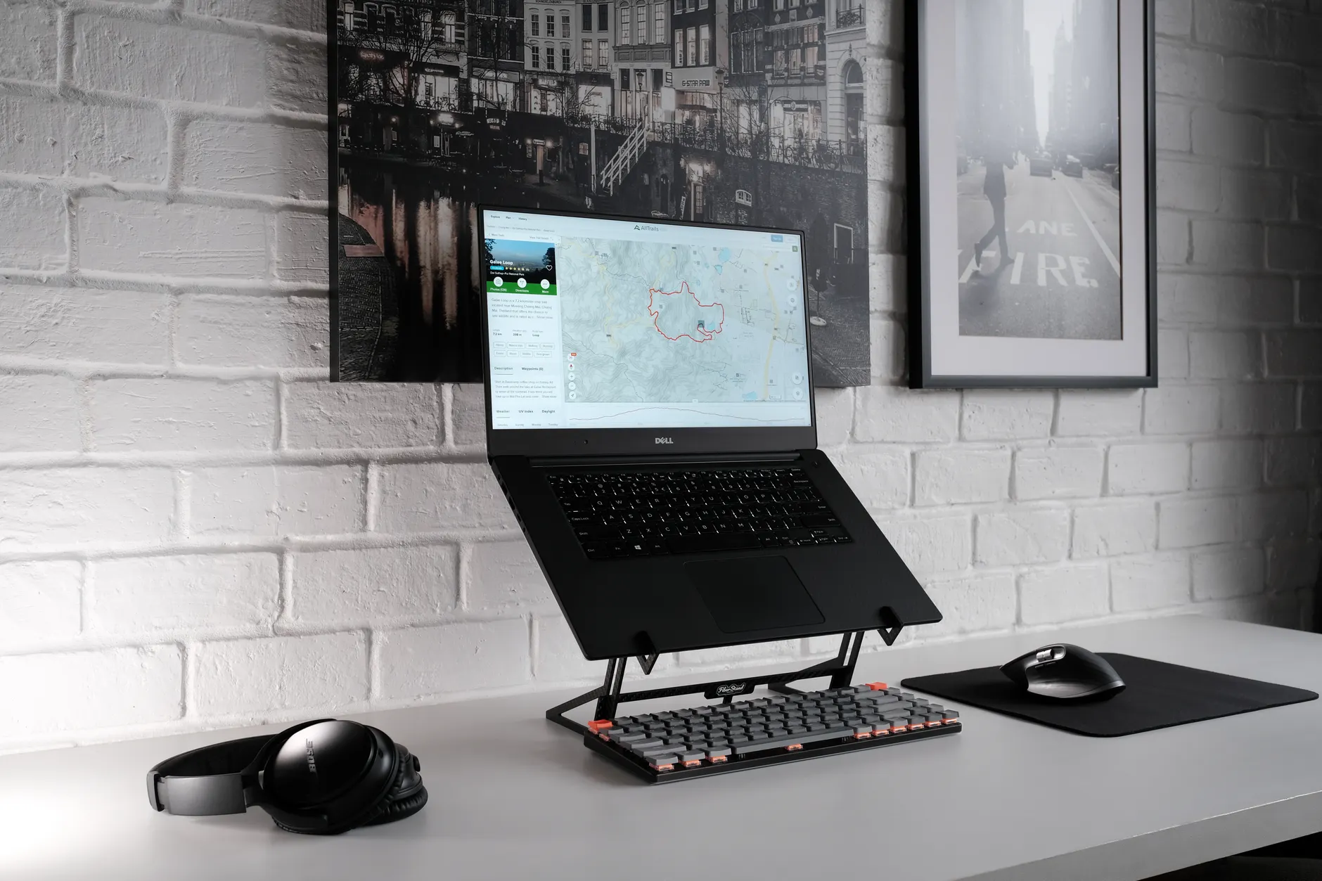 Hero image of Clean product photo of the Nexstand K2 portable laptop stand, ideally with a laptop placed on it showing the elevated screen angle