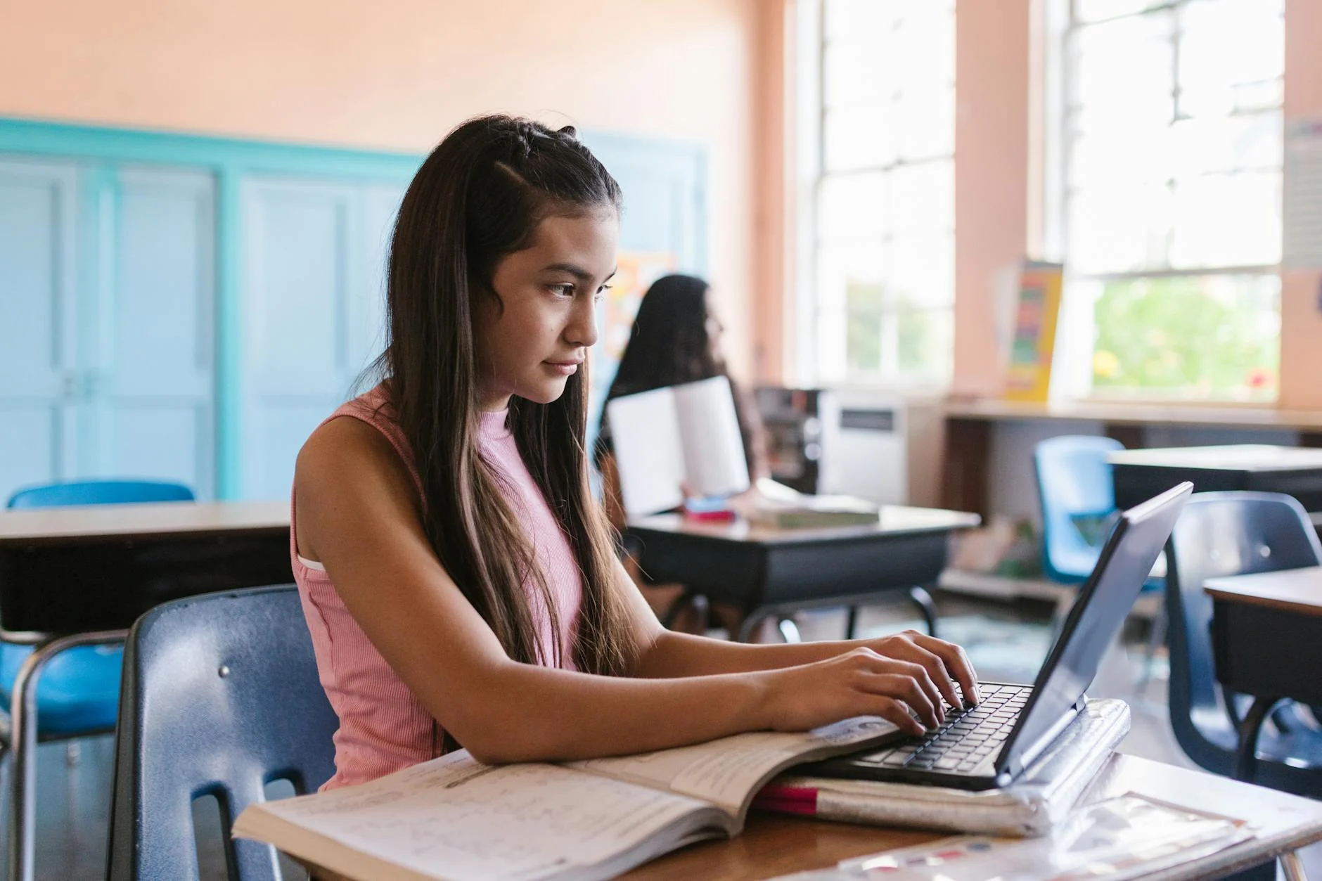School-age student using a laptop for homework