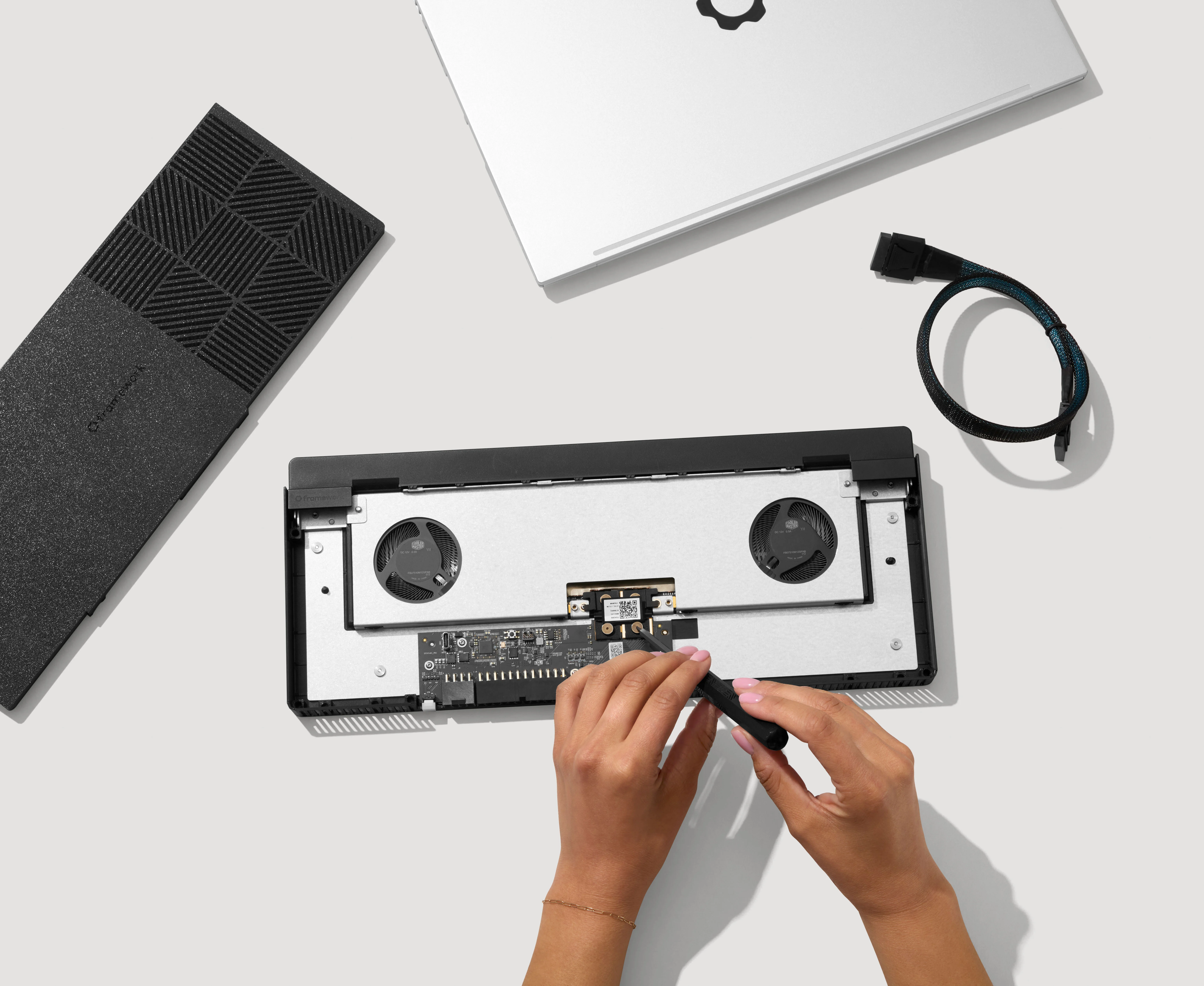 Features image of top down view of the Framework Laptop 16 keyboard with input module tiles