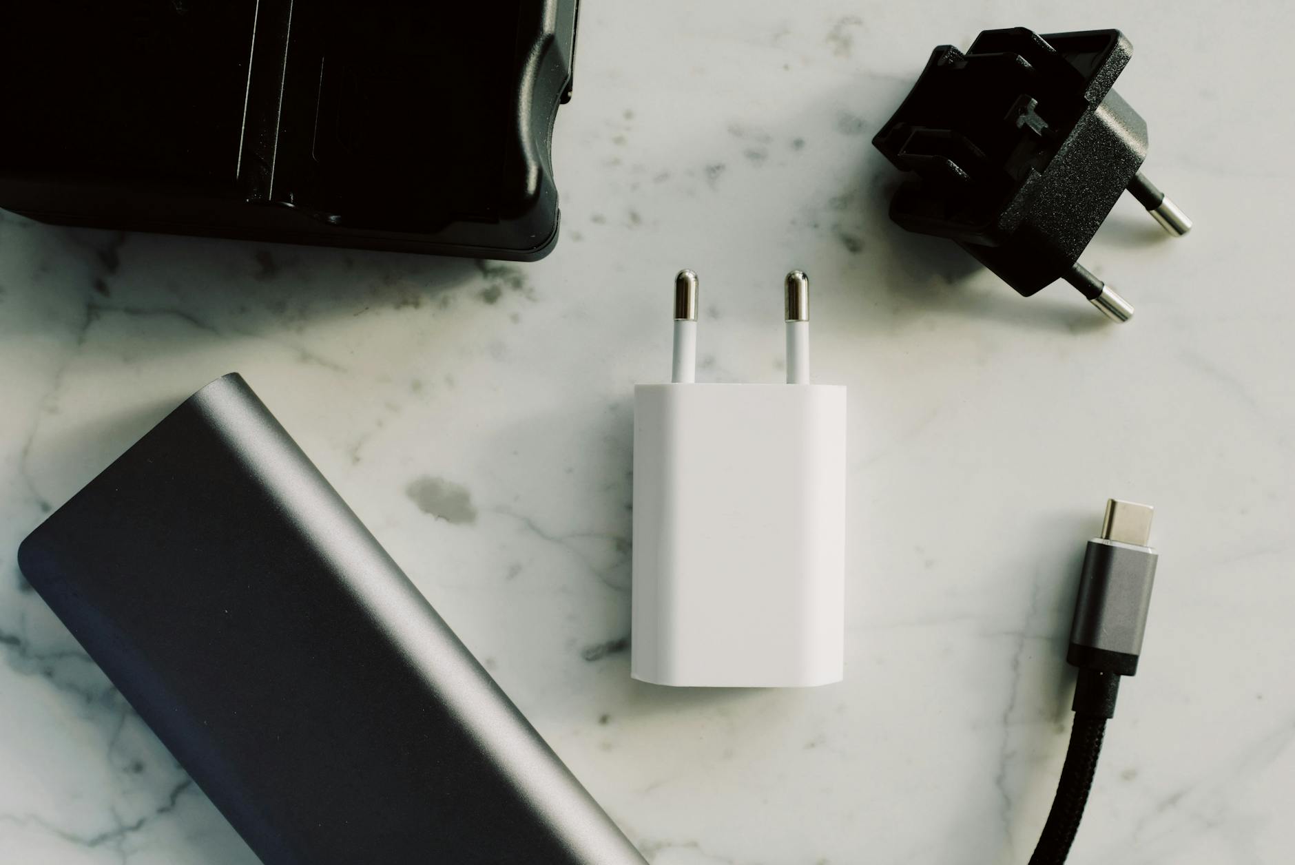 Traditional Charger Comparison image of Clear side-view product photo of a standard traditional wall charger brick to visually contrast with GaN alternatives in a size comparison context