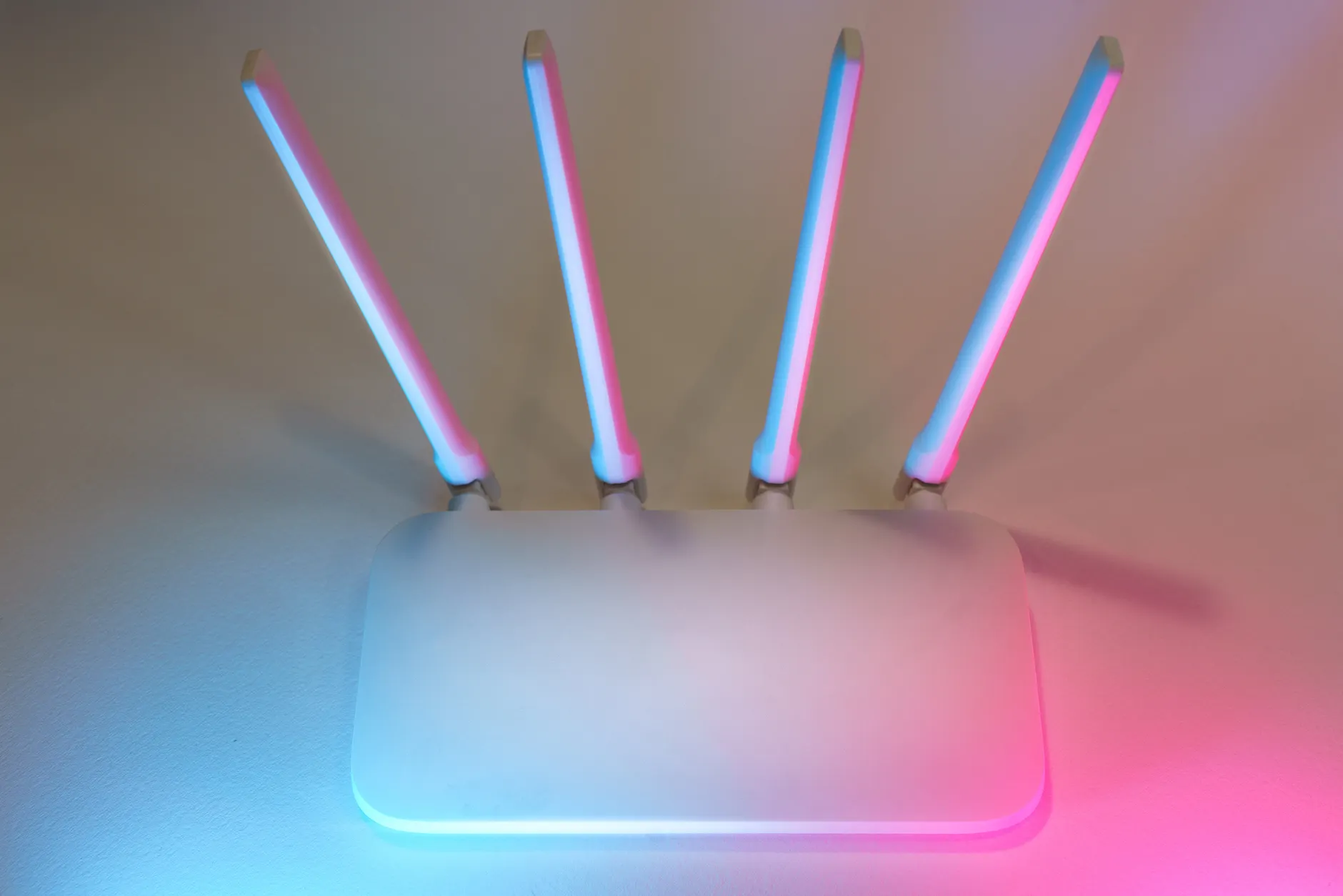 Hero image of Clean product photo of a home WiFi router set up as an access point on a desk or shelf, showing ethernet cable connected, with clear indicator lights visible