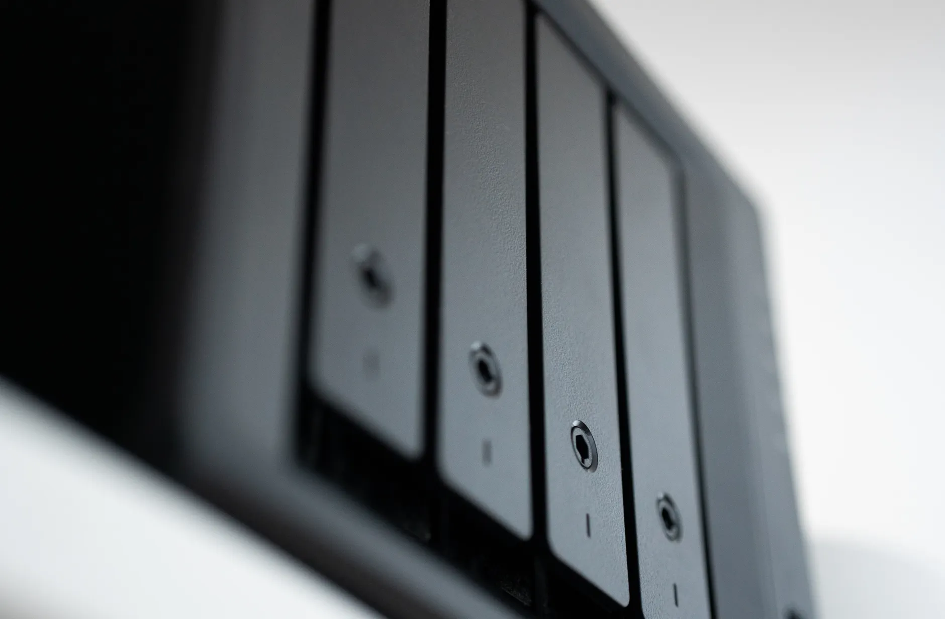 Hero image of Clean official or review photo of the Synology DS223j NAS unit on a desk, showing front panel drives and status LEDs clearly