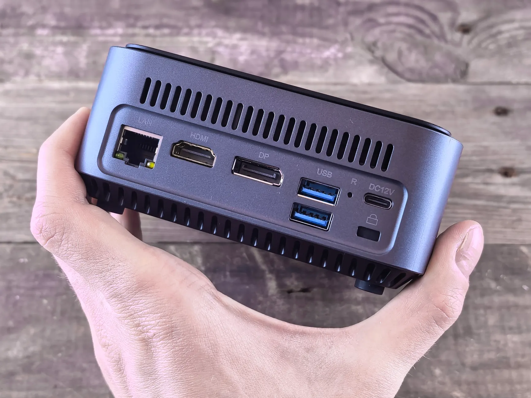 Mini PC Section image of Hands-on or unboxing photo of the Intel NUC 13 Pro compact mini PC, showing the small form factor box next to common objects for scale