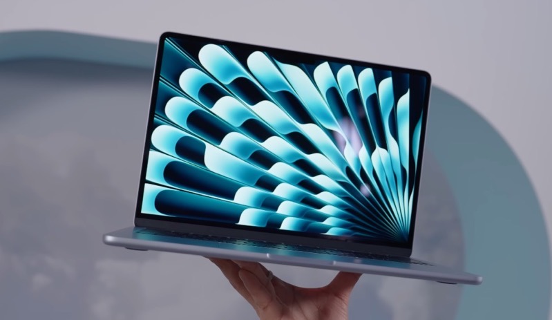 Performance image of Person actively using the MacBook Air M4 on a desk, fingers on keyboard, screen clearly visible