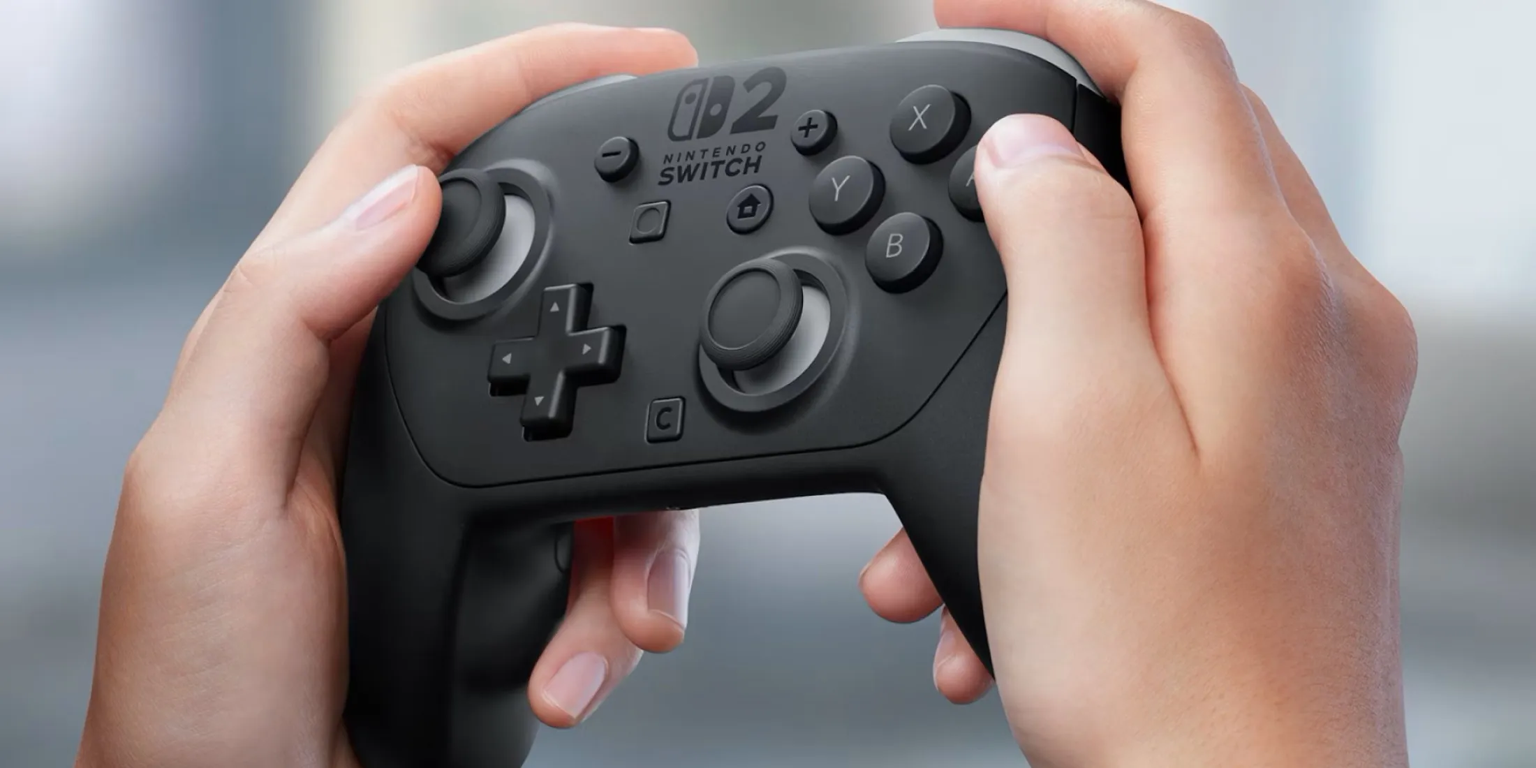 The official Switch 2 Pro Controller alongside the image of Image for: The official Switch 2 Pro Controller alongside the Joy-Con 2 grip - the Pro is much more comfortable for long sessions.