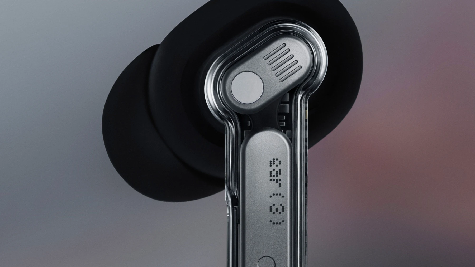 Close-up of the Nothing Ear (3) earbud, transparent stem and metal antenna