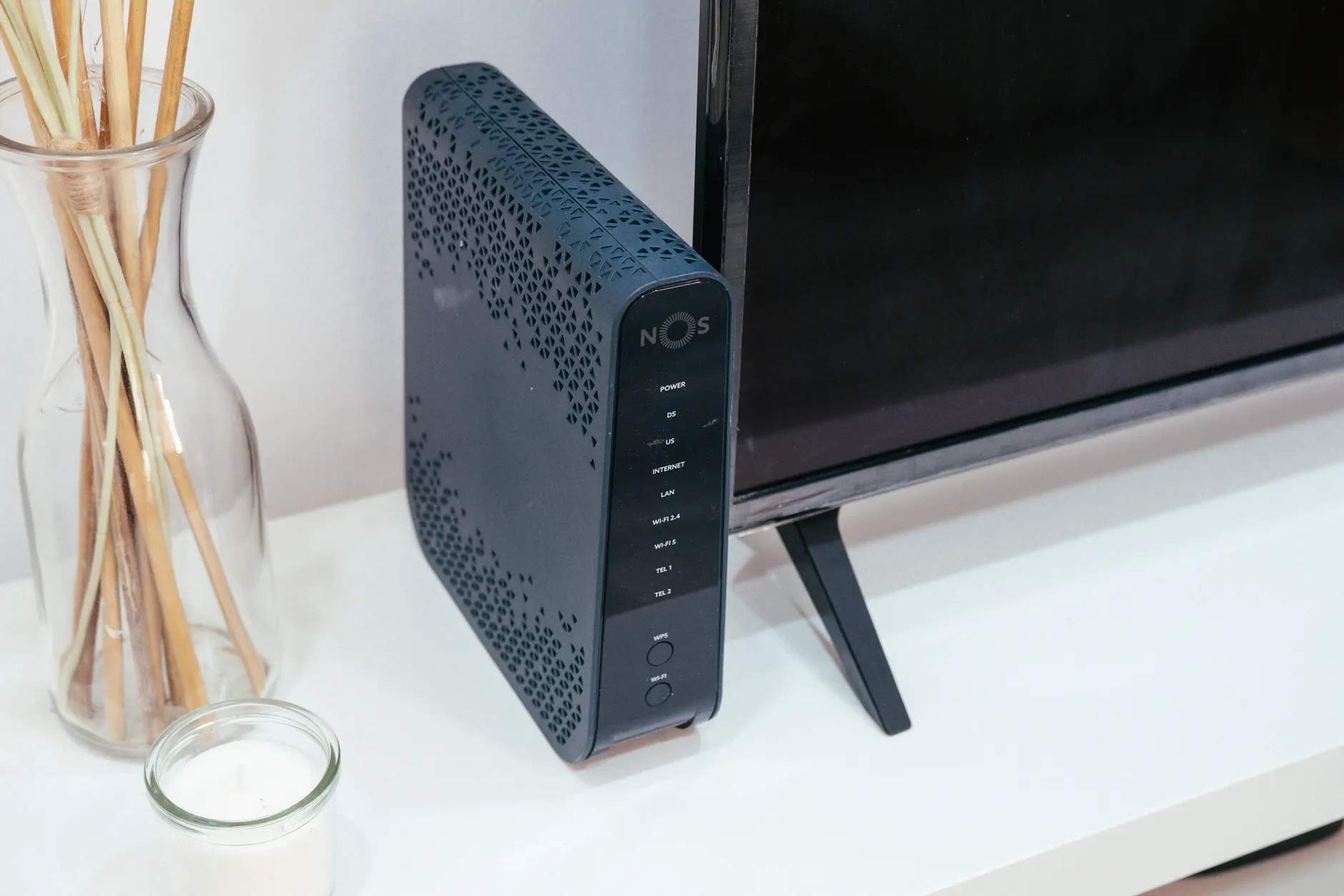 Hero image of Clean product photo of a smart home hub or router on a desk, clearly showing the device in a home environment, well-lit official-style photography