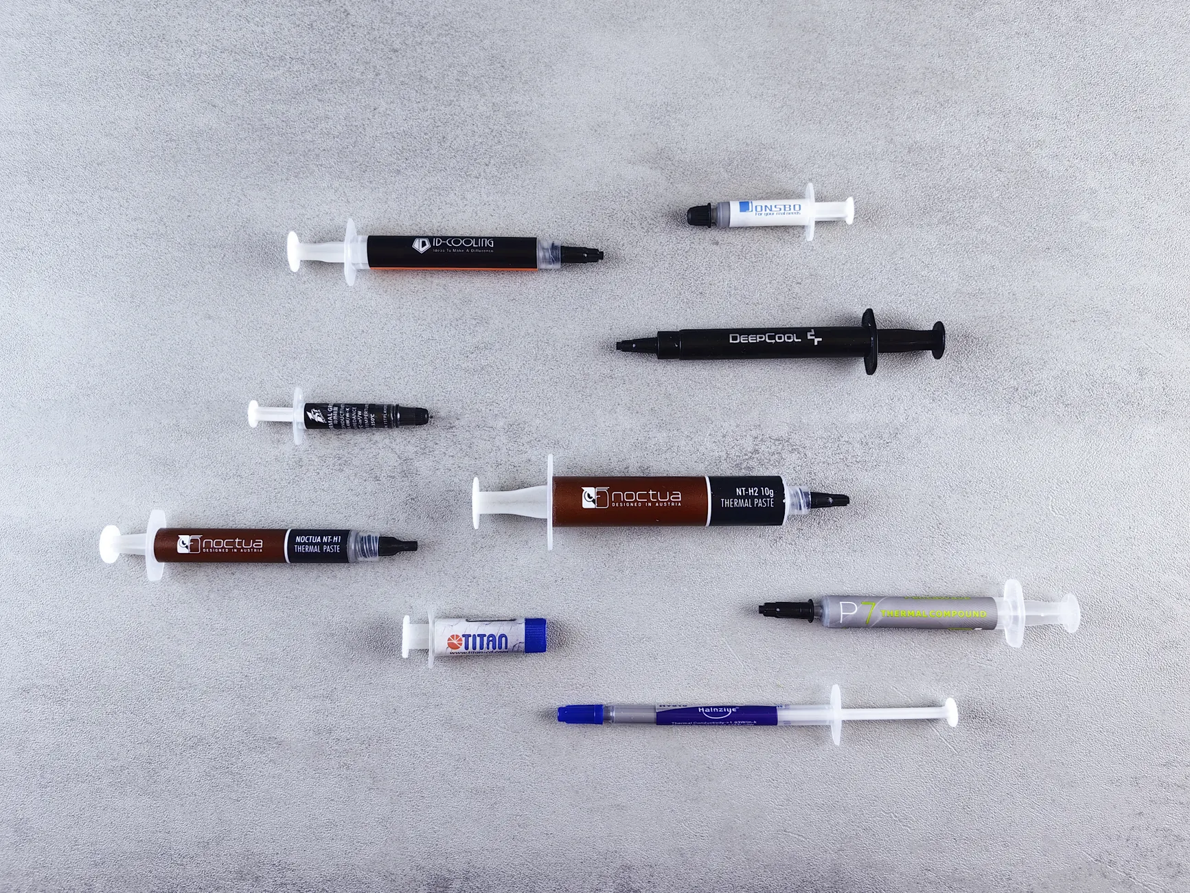 Thermal Compounds image of Front-facing product photo or unboxing image of the Arctic MX-6 thermal compound tube showing the syringe and packaging clearly