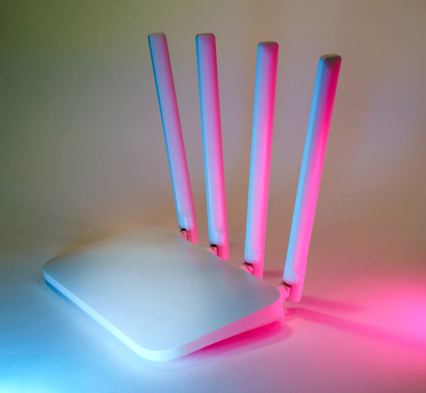 Hero image of Clean product photo showing a Wi-Fi extender, mesh node, and powerline adapter side by side on a white or neutral surface, official press or review photography