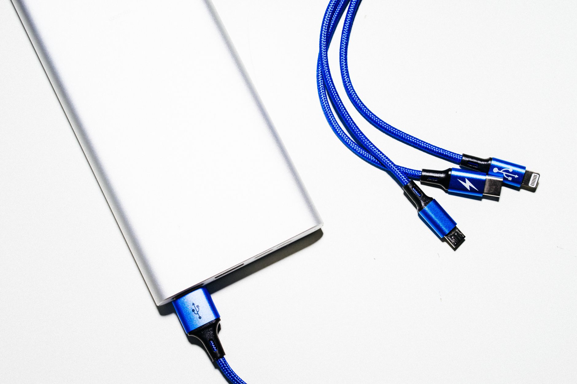 Charging Tips image of Close-up product photo of a USB-C cable plugged into a smartphone charging port, showing the physical connection clearly on a real device